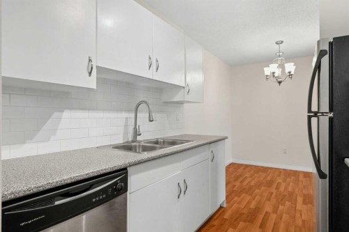 607-8948 Elbow Drive Sw, Calgary, AB - Indoor Photo Showing Kitchen With Stainless Steel Kitchen With Double Sink With Upgraded Kitchen