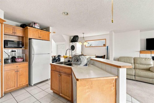 162 Taradale Drive Ne, Calgary, AB - Indoor Photo Showing Kitchen With Double Sink