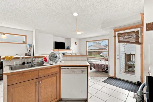 162 Taradale Drive Ne, Calgary, AB - Indoor Photo Showing Kitchen With Double Sink