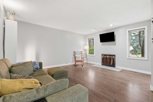 816 Ranchview Circle Nw, Calgary, AB - Indoor Photo Showing Living Room With Fireplace