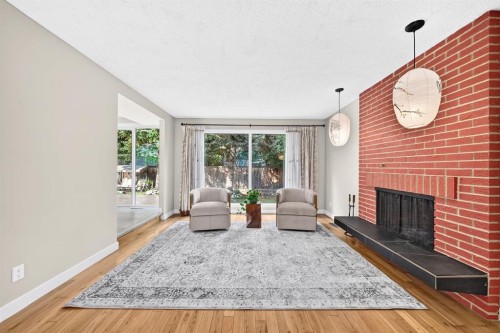 39 Woodfield Crescent Sw, Calgary, AB - Indoor Photo Showing Living Room With Fireplace