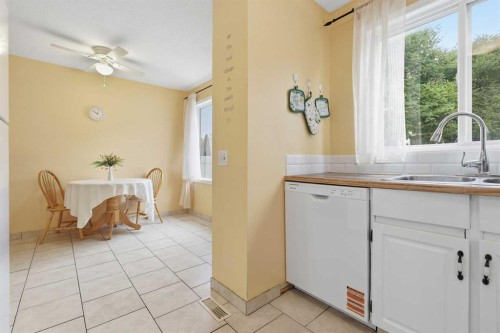 224-999 Canyon Meadows Drive Sw, Calgary, AB - Indoor Photo Showing Kitchen With Double Sink