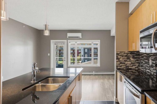 402-11 Millrise Drive Sw, Calgary, AB - Indoor Photo Showing Kitchen With Double Sink With Upgraded Kitchen