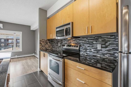 402-11 Millrise Drive Sw, Calgary, AB - Indoor Photo Showing Kitchen With Upgraded Kitchen