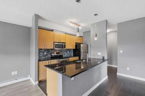 402-11 Millrise Drive Sw, Calgary, AB - Indoor Photo Showing Kitchen With Double Sink