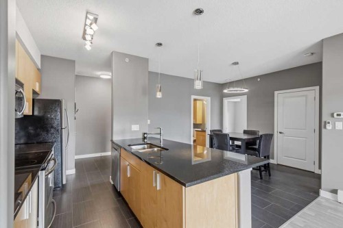 402-11 Millrise Drive Sw, Calgary, AB - Indoor Photo Showing Kitchen With Double Sink With Upgraded Kitchen