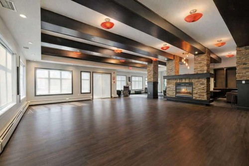 402-11 Millrise Drive Sw, Calgary, AB - Indoor Photo Showing Other Room With Fireplace
