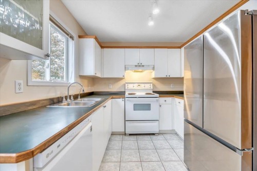 131 Hidden Way Nw, Calgary, AB - Indoor Photo Showing Kitchen With Double Sink