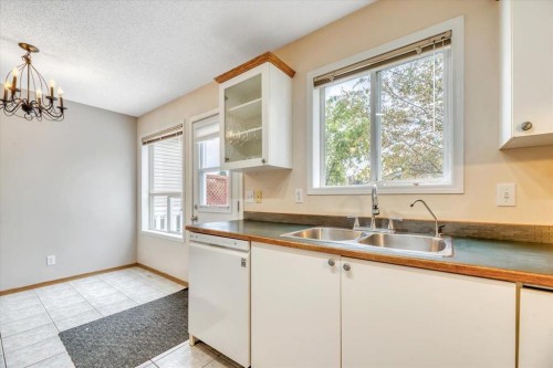 131 Hidden Way Nw, Calgary, AB - Indoor Photo Showing Kitchen With Double Sink