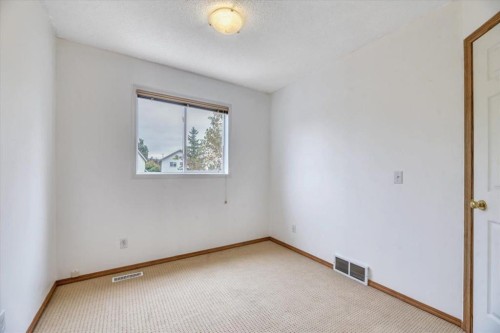 131 Hidden Way Nw, Calgary, AB - Indoor Photo Showing Other Room