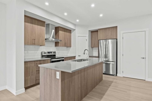 3301-100 Banister Drive, Okotoks, AB - Indoor Photo Showing Kitchen With Stainless Steel Kitchen With Double Sink With Upgraded Kitchen