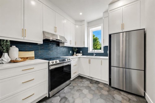 49 Rockhaven Green Nw, Calgary, AB - Indoor Photo Showing Kitchen With Upgraded Kitchen
