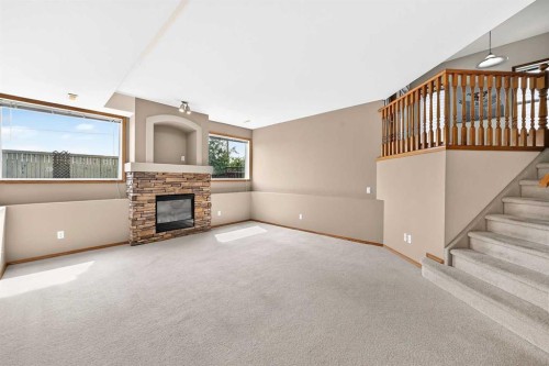168 Somerglen Common Sw, Calgary, AB - Indoor With Fireplace