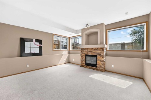 168 Somerglen Common Sw, Calgary, AB - Indoor With Fireplace