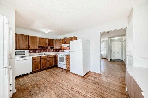 6840 4 Avenue Ne, Calgary, AB - Indoor Photo Showing Kitchen With Double Sink