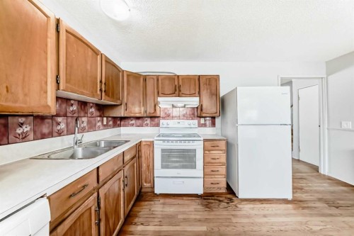6840 4 Avenue Ne, Calgary, AB - Indoor Photo Showing Kitchen With Double Sink