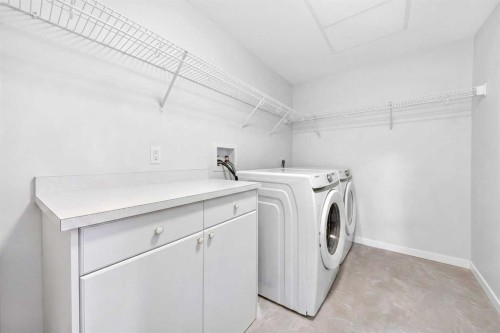 1211-220 Seton Grove Se, Calgary, AB - Indoor Photo Showing Laundry Room