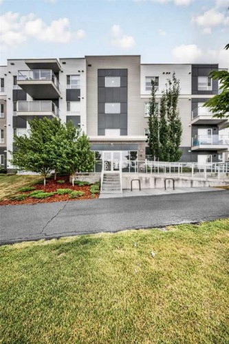 1211-220 Seton Grove Se, Calgary, AB - Outdoor With Balcony With Facade