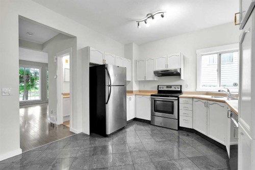 7097 Laguna Way Ne, Calgary, AB - Indoor Photo Showing Kitchen With Stainless Steel Kitchen