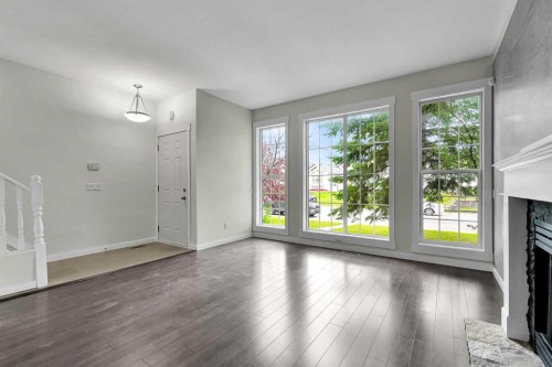 7097 Laguna Way Ne, Calgary, AB - Indoor With Fireplace
