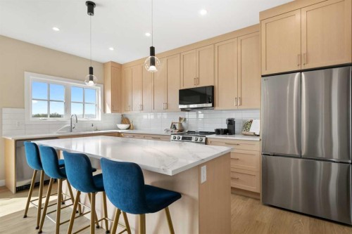 329 Flare Avenue Sw, Diamond Valley, AB - Indoor Photo Showing Kitchen With Upgraded Kitchen