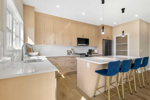 329 Flare Avenue Sw, Diamond Valley, AB - Indoor Photo Showing Kitchen With Upgraded Kitchen