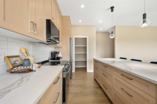 329 Flare Avenue Sw, Diamond Valley, AB - Indoor Photo Showing Kitchen With Upgraded Kitchen