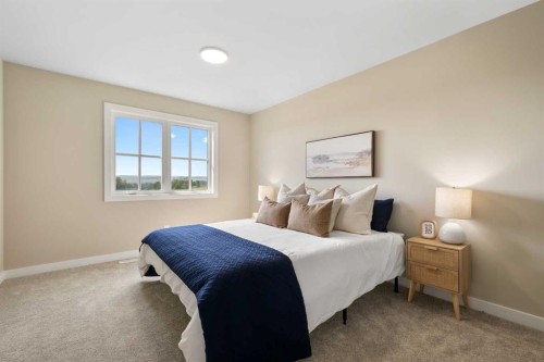 329 Flare Avenue Sw, Diamond Valley, AB - Indoor Photo Showing Bedroom
