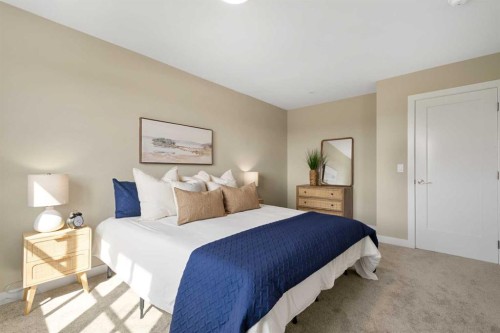 329 Flare Avenue Sw, Diamond Valley, AB - Indoor Photo Showing Bedroom