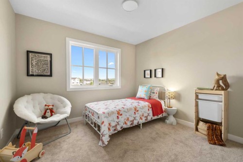 329 Flare Avenue Sw, Diamond Valley, AB - Indoor Photo Showing Bedroom