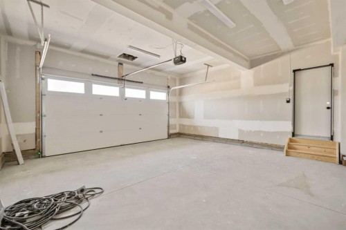 329 Flare Avenue Sw, Diamond Valley, AB - Indoor Photo Showing Garage