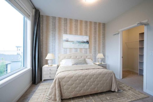 84 Shawnee Common Sw, Calgary, AB - Indoor Photo Showing Bedroom