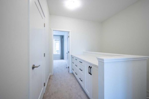 84 Shawnee Common Sw, Calgary, AB - Indoor Photo Showing Other Room
