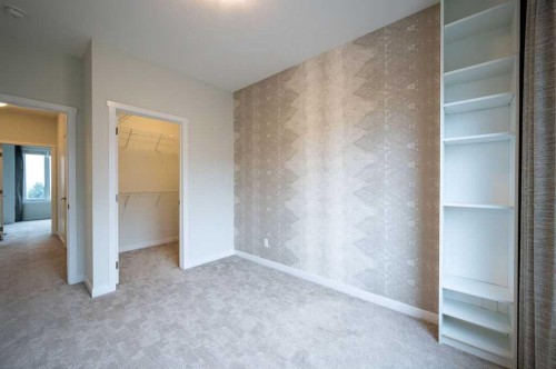 84 Shawnee Common Sw, Calgary, AB - Indoor Photo Showing Other Room