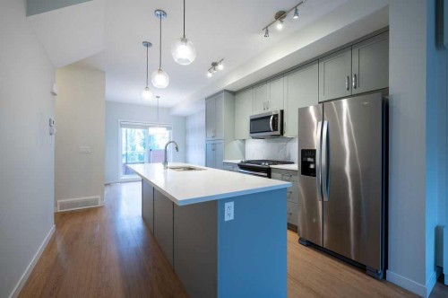84 Shawnee Common Sw, Calgary, AB - Indoor Photo Showing Kitchen With Upgraded Kitchen