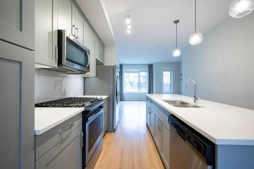 84 Shawnee Common Sw, Calgary, AB - Indoor Photo Showing Kitchen With Double Sink With Upgraded Kitchen