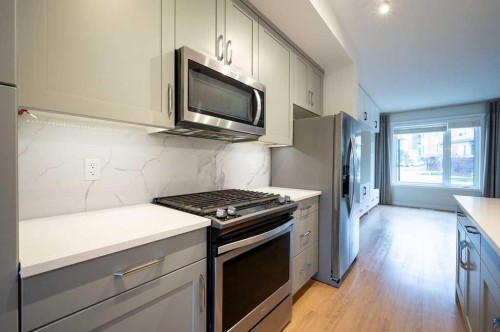 84 Shawnee Common Sw, Calgary, AB - Indoor Photo Showing Kitchen With Upgraded Kitchen