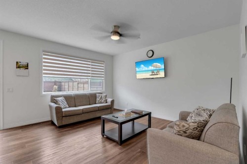 244 Lucas Way Nw, Calgary, AB - Indoor Photo Showing Living Room