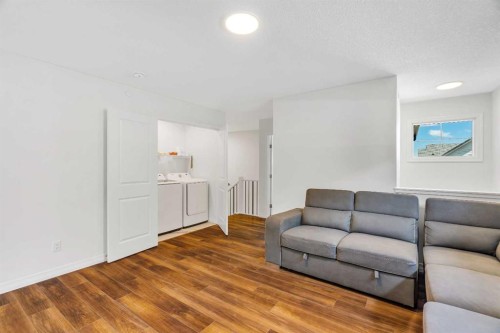 244 Lucas Way Nw, Calgary, AB - Indoor Photo Showing Living Room