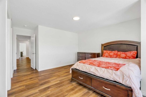 244 Lucas Way Nw, Calgary, AB - Indoor Photo Showing Bedroom