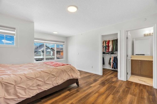 244 Lucas Way Nw, Calgary, AB - Indoor Photo Showing Bedroom
