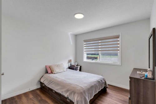 244 Lucas Way Nw, Calgary, AB - Indoor Photo Showing Bedroom