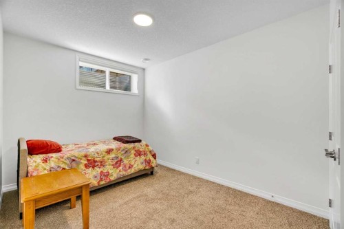 244 Lucas Way Nw, Calgary, AB - Indoor Photo Showing Bedroom