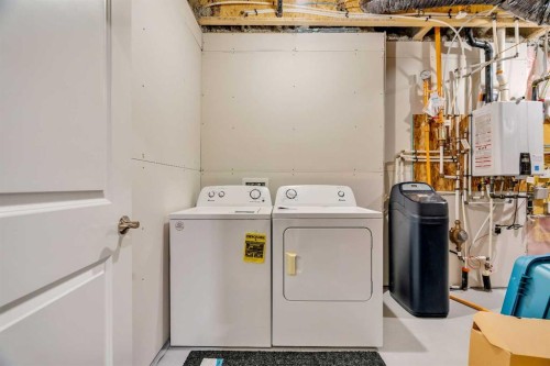 244 Lucas Way Nw, Calgary, AB - Indoor Photo Showing Laundry Room