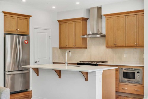 244 Lucas Way Nw, Calgary, AB - Indoor Photo Showing Kitchen With Stainless Steel Kitchen With Upgraded Kitchen