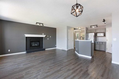 7269 Laguna Way Ne, Calgary, AB - Indoor With Fireplace