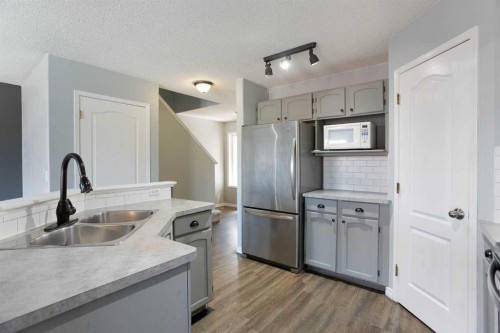 7269 Laguna Way Ne, Calgary, AB - Indoor Photo Showing Kitchen With Double Sink