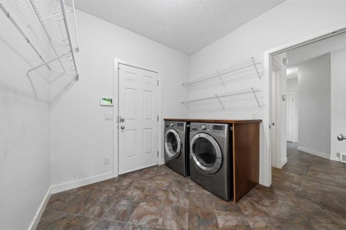 204 Eversyde Mews Sw, Calgary, AB - Indoor Photo Showing Laundry Room