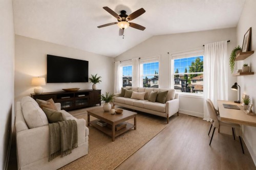 204 Eversyde Mews Sw, Calgary, AB - Indoor Photo Showing Living Room