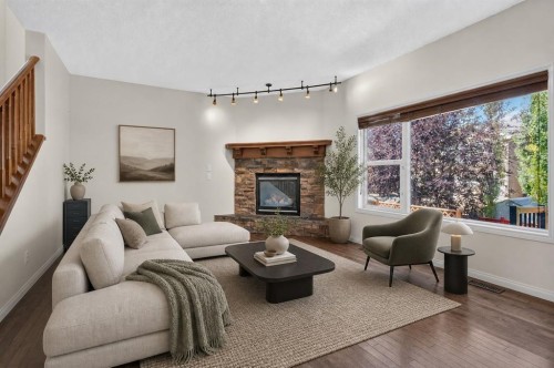 164 Aspenmere Close, Chestermere, AB - Indoor Photo Showing Living Room With Fireplace